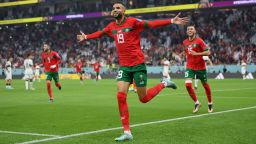 Youssef En-Nesyri of Morocco celebrates after scoring the team's first goal during the FIFA World Cup Qatar 2022 quarter final match between Morocco and Portugal at Al Thumama Stadium on December 10, 2022 in Doha, Qatar. 