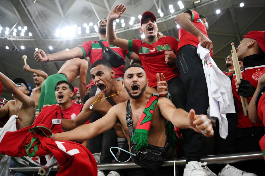 Morocco fans celebrate in the stands following their team's victory on December 10. 