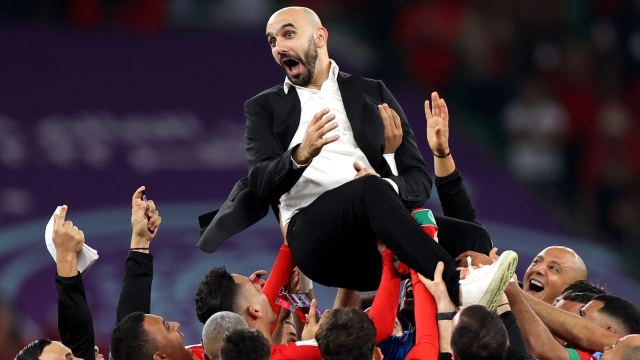 Walid Regragui, Head Coach of Morocco, celebrates with the team after the 1-0 win during the FIFA World Cup Qatar 2022 quarter final match between Morocco and Portugal at Al Thumama Stadium on December 10, 2022 in Doha, Qatar. 