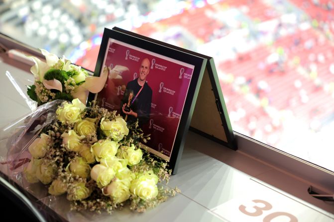 A memorial for American journalist Grant Wahl sits in the press area of Al Bayt Stadium on December 10. <a href="index.php?page=&url=https%3A%2F%2Fwww.cnn.com%2F2022%2F12%2F14%2Fus%2Fgrant-wahl-cause-death%2Findex.html" target="_blank">Wahl died after collapsing</a> during the quarterfinal match between Argentina and the Netherlands. His wife, Dr. Celine Gounder, said he died of an aortic aneurysm that ruptured.