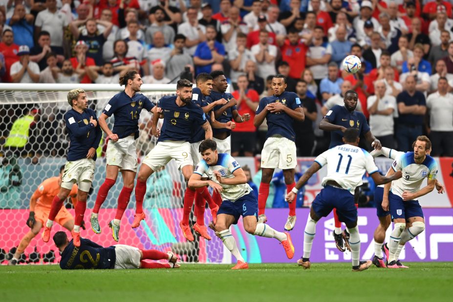 French players try to block a Marcus Rashford free kick late in the match.