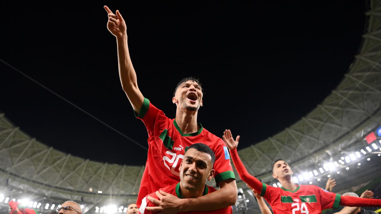 Achraf Dari and Walid Cheddira of Morocco celebrate the team's 1-0 World Cup quarterfinal victory against Portugal