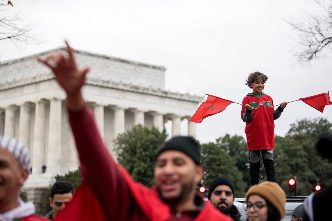 Morocco fans celebrate their historic World Cup victory over Portugal near the Lincoln Memorial in Washington, U.S.