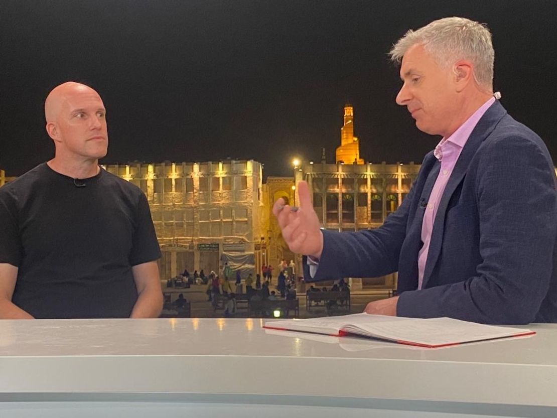 Grant Wahl (left) being interviewed by CNN's Don Riddel in Qatar. 