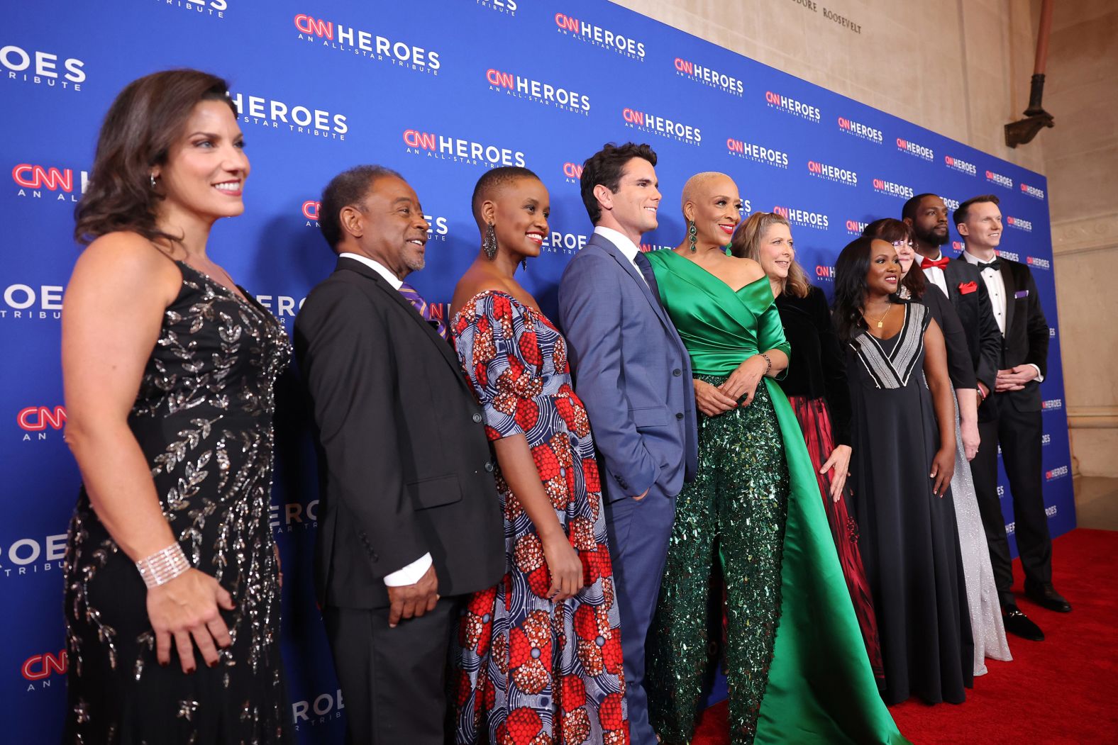 From left, CNN Heroes Nora El-Khouri Spencer, Bobby Wilson, Nelly Cheboi, Aidan Reilly, Debra Vines, Carie Broecker, Meymuna Hussein-Cattan, Teresa Gray, Tyrique Glasgow and Richard Casper walk the red carpet before the event.