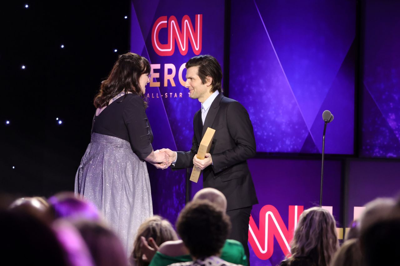 CNN Hero Teresa Gray accepts her award from actor Adam Scott.