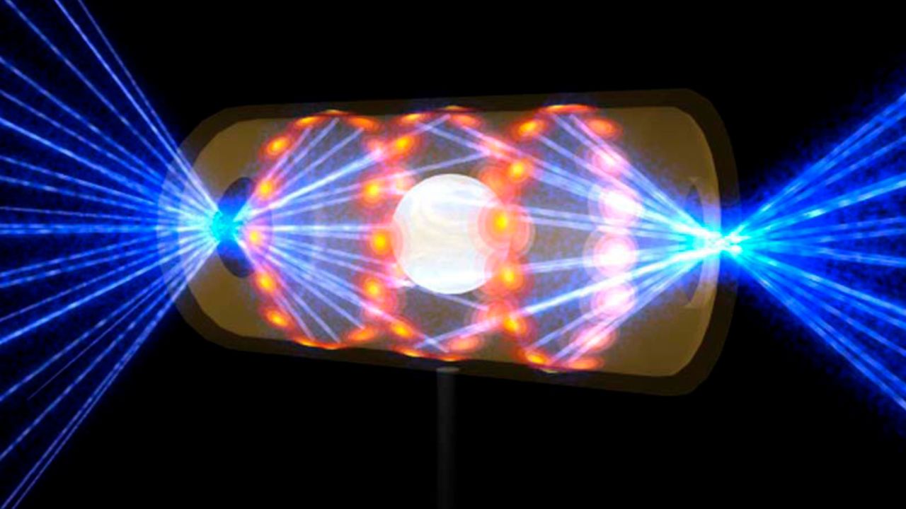 This illustration provided by the National Ignition Facility at the Lawrence Livermore National Laboratory depicts a target pellet inside a hohlraum capsule with laser beams entering through openings on either end. The beams compress and heat the target to the necessary conditions for nuclear fusion to occur. (Lawrence Livermore National Laboratory via AP)