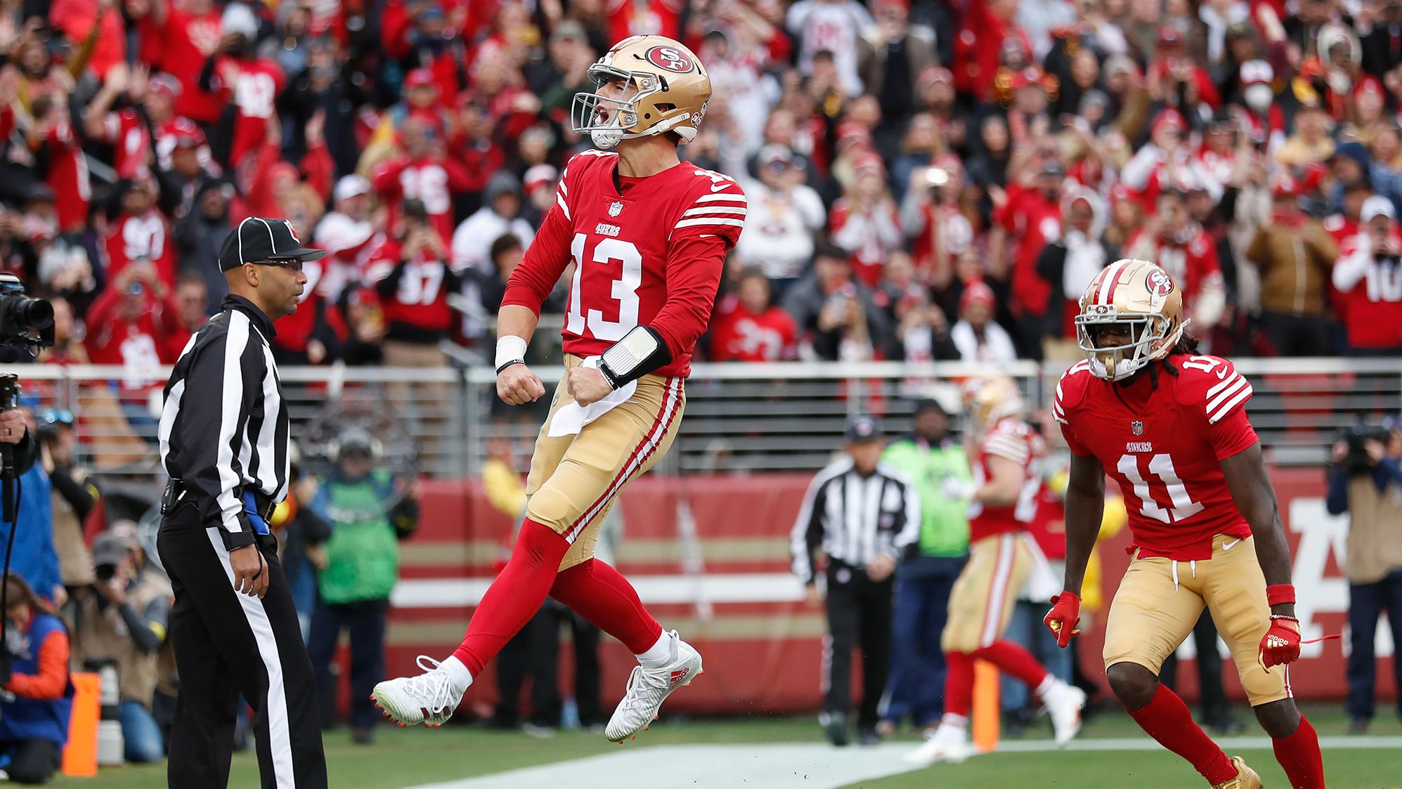 San Francisco 49ers quarterback Brock Purdy celebrates after running for a touchdown against the Tampa Bay Buccaneers on December 11. The rookie also threw for two touchdowns in the <a href="index.php?page=&url=https%3A%2F%2Fwww.cnn.com%2F2022%2F12%2F11%2Fus%2Fbrock-purdy-tom-brady-upset-win-spt-intl%2Findex.html" target="_blank">35-7 blowout win</a>.