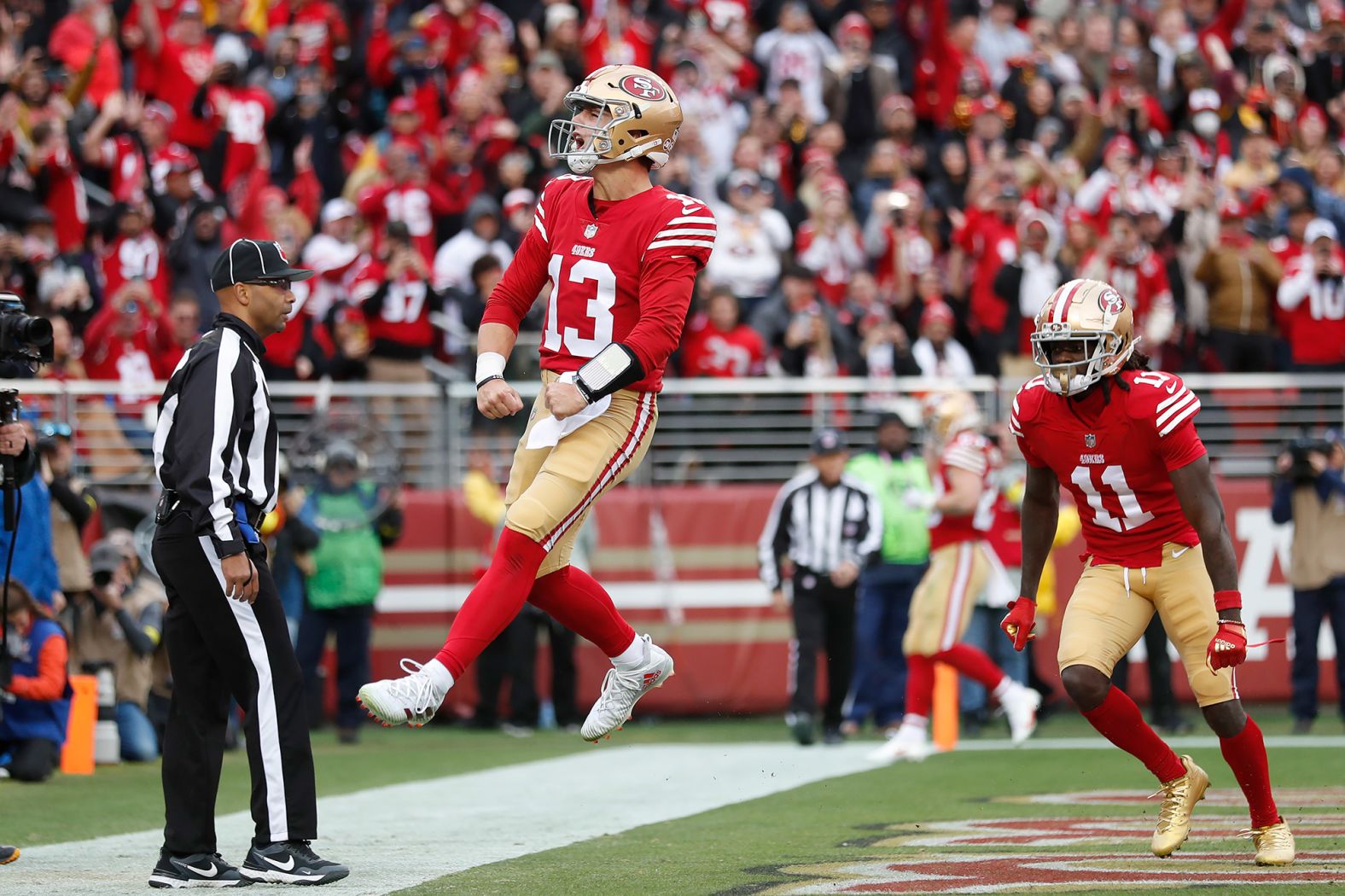 San Francisco 49ers quarterback Brock Purdy celebrates after running for a touchdown against the Tampa Bay Buccaneers on December 11. The rookie also threw for two touchdowns in the <a href="index.php?page=&url=https%3A%2F%2Fwww.cnn.com%2F2022%2F12%2F11%2Fus%2Fbrock-purdy-tom-brady-upset-win-spt-intl%2Findex.html" target="_blank">35-7 blowout win</a>.