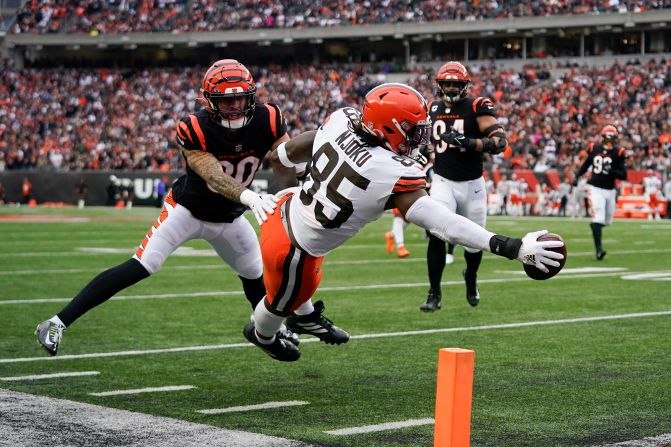 Cleveland Browns tight end David Njoku reaches for a touchdown against the Cincinnati Bengals on Sunday, December 11. It was Deshaun Watson's first touchdown pass for the Browns since <a href="index.php?page=&url=https%3A%2F%2Fwww.cnn.com%2F2022%2F12%2F05%2Fsport%2Fdeshaun-watson-return-browns-texans-spt-intl%2Findex.html" target="_blank">returning from an 11-game suspension</a> over sexual misconduct allegations. Despite the touchdown, the Bengals won 23-10.