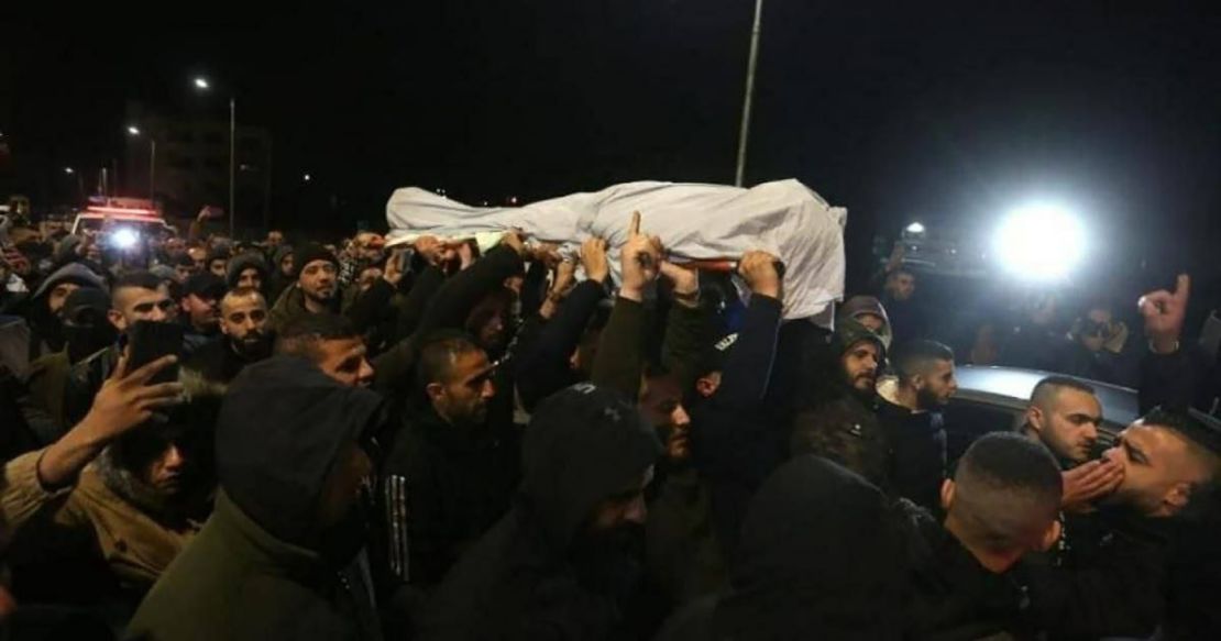 Mourners carry Jana Zakarneh's shroud during her funeral procession. 