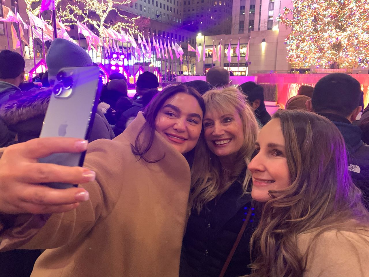 The trio snap a selfie Saturday night at Rockefeller Center in New York.