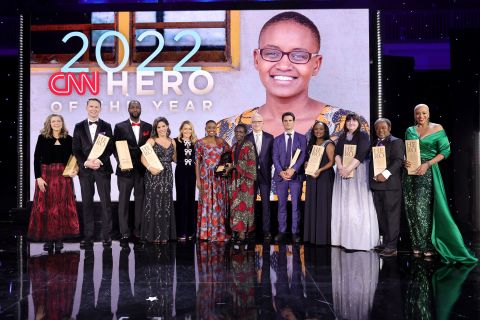 This year's CNN Heroes pose on stage with hosts Anderson Cooper and Kelly Ripa on Sunday, December 11. From left are Carie Broecker; Richard Casper; Tyrique Glasgow; Nora El-Khouri Spencer; Ripa; CNN Hero of the Year Nelly Cheboi; Cheboi's mother, Christina Cheboi Chebii; Cooper; Aidan Reilly; Meymuna Hussein-Cattan; Teresa Gray; Bobby Wilson; and Debra Vines.
