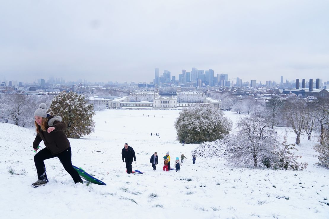 People sledging in the snow at Greenwich Park in London on Monday.