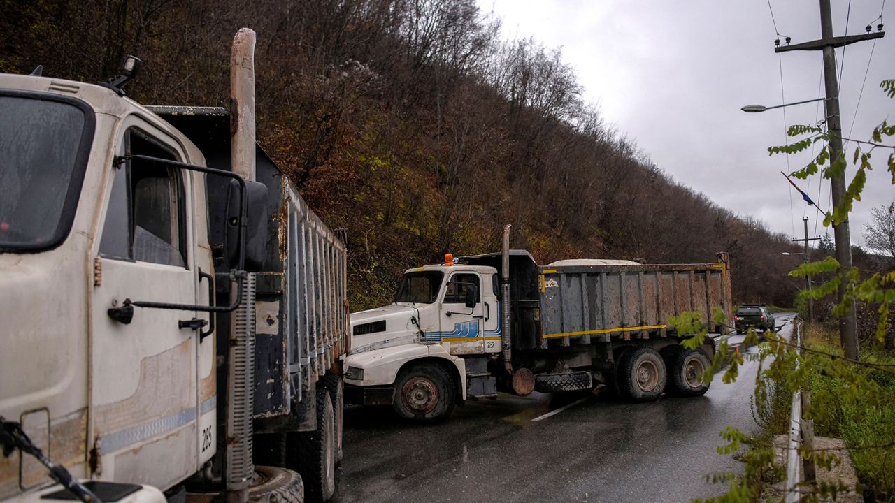 NATO soldiers serving in the peacekeeping mission in Kosovo (KFOR) arrive to inspect a road barricade set up by ethnic Serbs near the town of Zubin Potok on December 11, 2022.