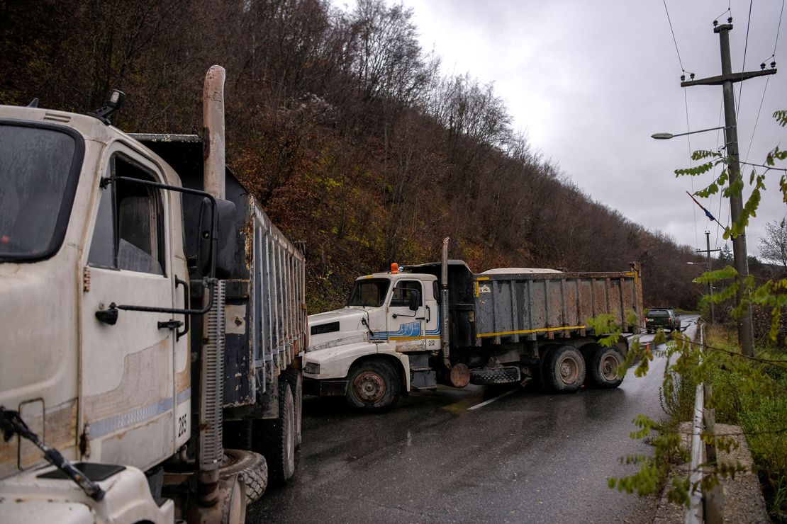 NATO soldiers serving in the peacekeeping mission in Kosovo (KFOR) arrive to inspect a road barricade set up by ethnic Serbs near the town of Zubin Potok on December 11, 2022.