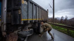  A NATO led Latvian soldier inspects a truck at a roadblock on one of the main roads to the border crossing point with Serbia on December 11, 2022 near Zubin Potok, Kosovo. 