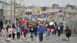 Protestors take over the Pan-American highway in the Northern Cone of Arequipa following the announcement by Peruvian new President Dina Boluarte of her intention of presenting a bill to parliament to advance the scheduled general elections from April 2026 to April 2024 in Arequipa, Peru, on December 12, 2022. - Protesters have demanded fresh elections and the resignation of new President Dina Boluarte, following the arrest of her leftist predecessor Castillo last week after he attempted to dissolve Congress and rule by decree. (Photo by Diego Ramos / AFP) (Photo by DIEGO RAMOS/AFP via Getty Images)