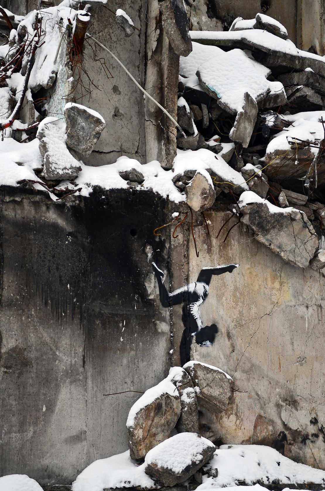 One of England-based street artist Banksy's seven murals featured a gymnast on the wall of an apartment building destroyed by Russian troops, Borodianka, Kyiv Region, northern Ukraine. 