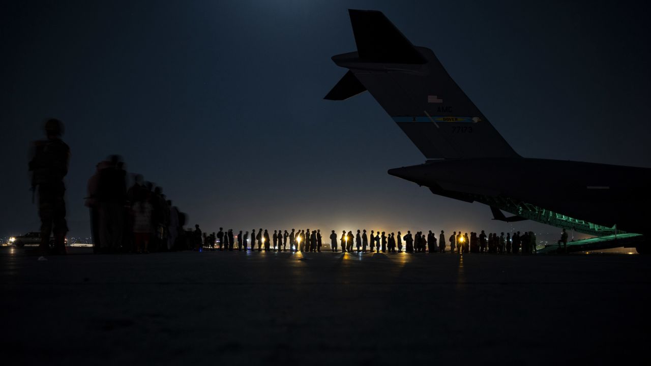 US Air Force aircrew prepare to load qualified evacuees at Hamid Karzai International Airport on August 21, 2021. 