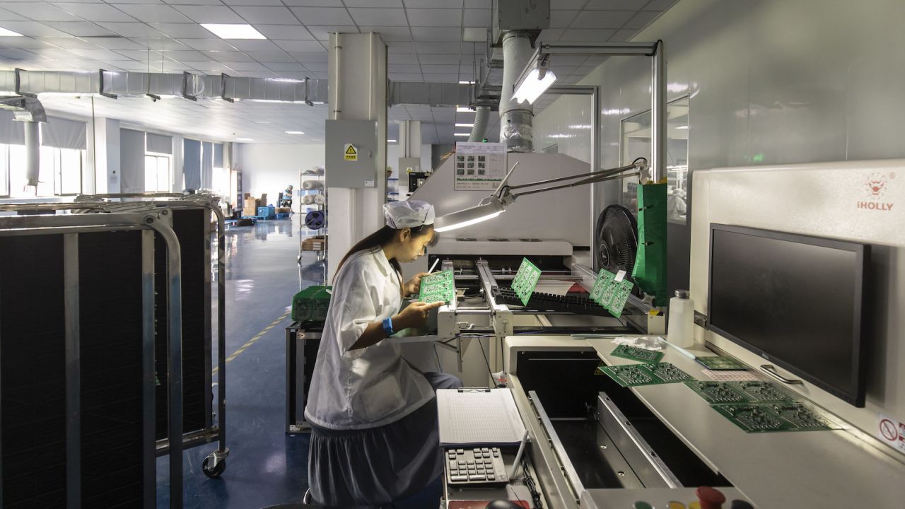 An employee inspects integrated circuit boards at the Smart Pioneer Electronics Co. factory in Suzhou, China, on Friday, Sept. 23, 2022. In a world where chips are becoming smarter and smaller, they require much less advanced technology to manufacture and therefore command smaller margins. Photographer: Qilai Shen/Bloomberg