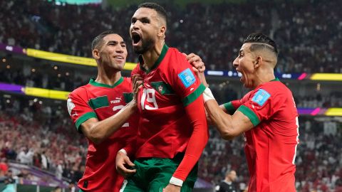 Morocco's Youssef En-Nesyri, center, celebrates after scoring the only goal in his side's World Cup quarterfinal win over Portugal, at Al Thumama Stadium in Doha, Qatar, on December 10, 2022.