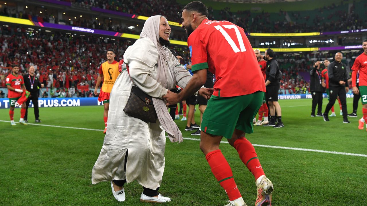 Sofiane Boufal of Morocco celebrates with a family member after the team's 1-0 victory in the FIFA World Cup Qatar 2022 quarter final match between Morocco and Portugal at Al Thumama Stadium on December 10, 2022 in Doha, Qatar.