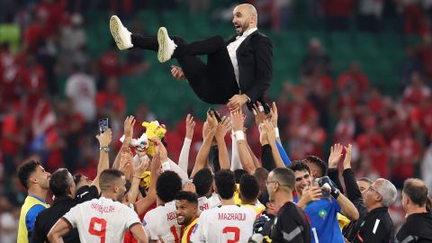 Walid Regragui, Morocco head coach, is thrown in the air after the team qualified for the World Cup knockout stages by beating Canada on December 1.
