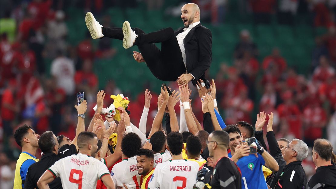 Walid Regragui, Morocco head coach, is thrown in the air after the team qualified for the World Cup knockout stages by beating Canada on December 1.