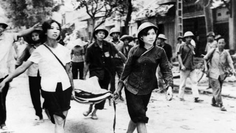 A picture released on December 19, 1972, of Vietnamese people carrying victims of the American air raids on Hanoi and North Vietnam.
