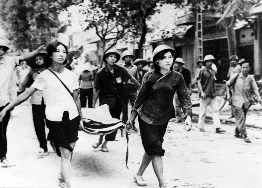 A picture released on December 19, 1972, of Vietnamese people carrying victims of the American air raids on Hanoi and North Vietnam.