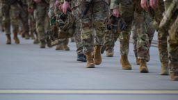 FORT BRAGG, NC - FEBRUARY 14: Soldiers with the 82nd Airborne division walk across the tarmac at Green Ramp to deploy to Poland on February 14, 2022 at Fort Bragg, Fayetteville, North Carolina. An estimated three thousand soldiers will be deployed as tensions rise in Eastern Europe. (Photo by Melissa Sue Gerrits/Getty Images)