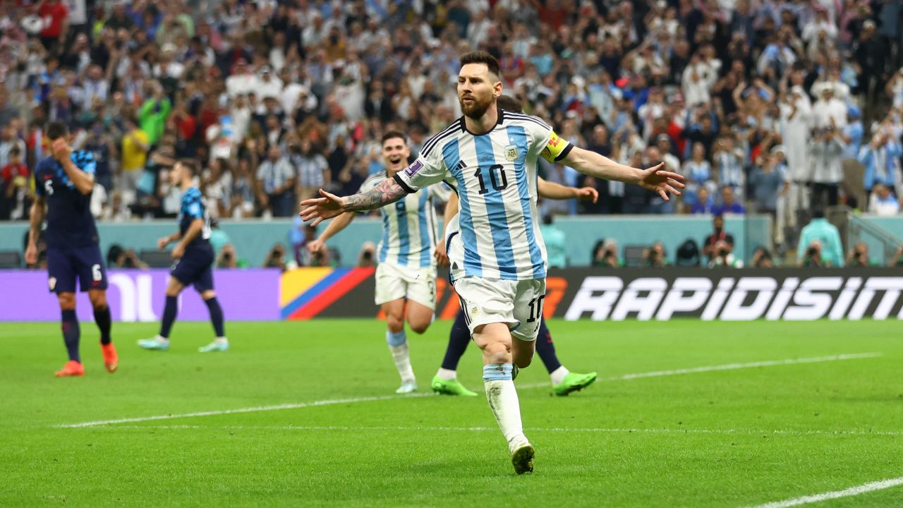 Lionel Messi celebrates after scoring Argentina's first goal from the penalty spot.