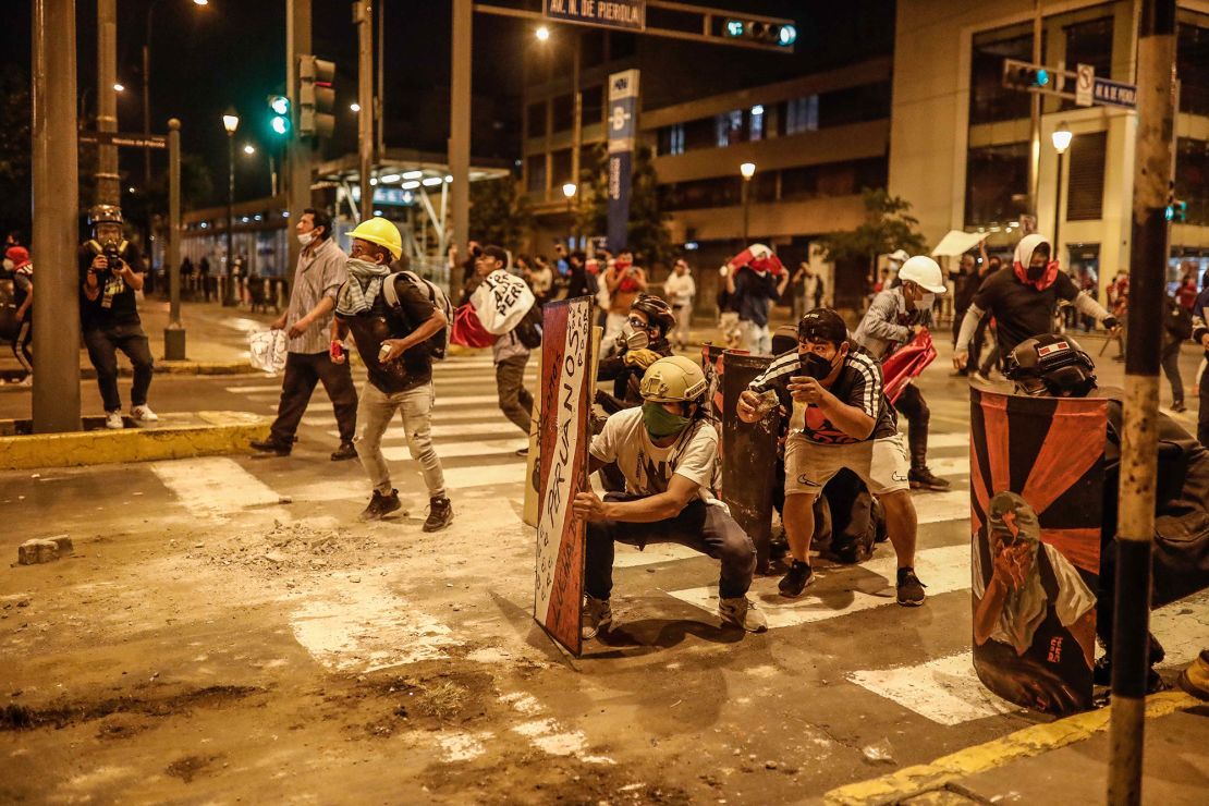 Demonstrators clash with police in the Peruvian capital Lima on Monday.