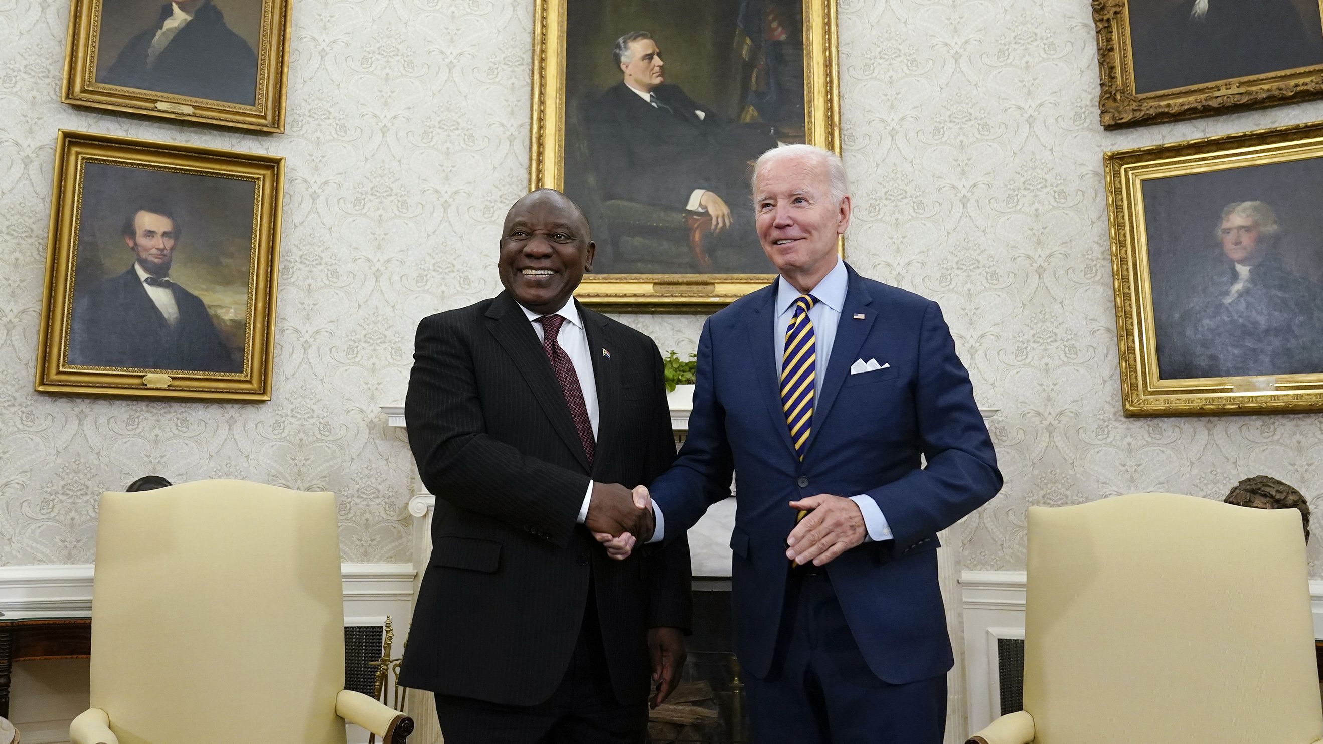 President Joe Biden shakes hands with South African President Cyril Ramaphosa as they meet in the Oval Office of the White House, Friday, Sept. 16, 2022, in Washington. 