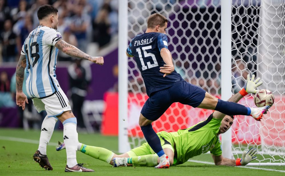 Argentina goalkeeper Emiliano Martinez reaches out for a save against Croatia.