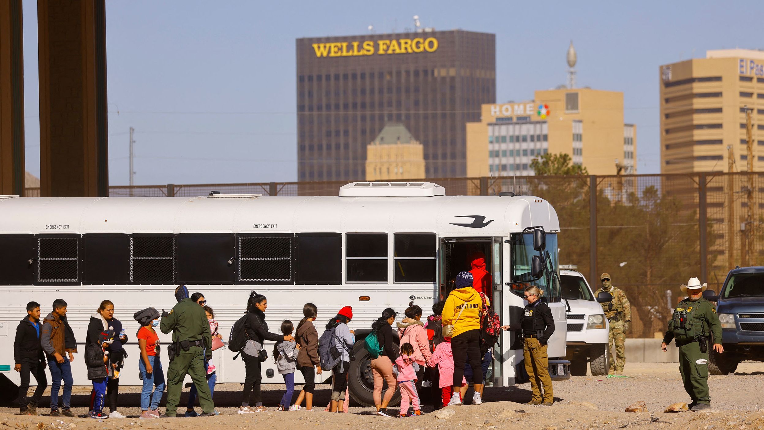 Migrants are detained by US Border Patrol agents after crossing the Rio Bravo river to turn themselves in to request for asylum in El Paso, Texas, as seen from Ciudad Juarez, Mexico December 12, 2022.
