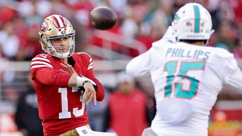 Purdy attempts a pass during the second quarter against the Dolphins.