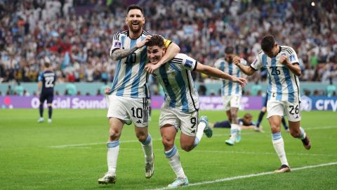 Julian Alvarez celebrates with Lionel Messi after doubling Argentina's lead.