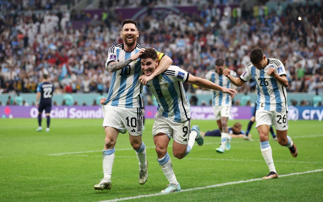 Julian Alvarez celebrates with Lionel Messi after doubling Argentina's lead.