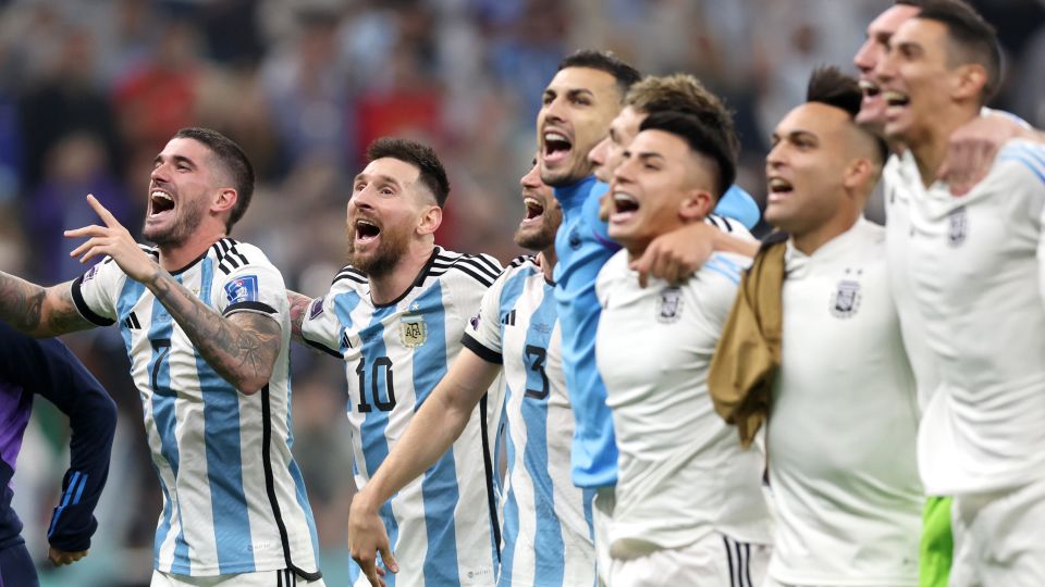 Argentina's players celebrate with their fans at full time.