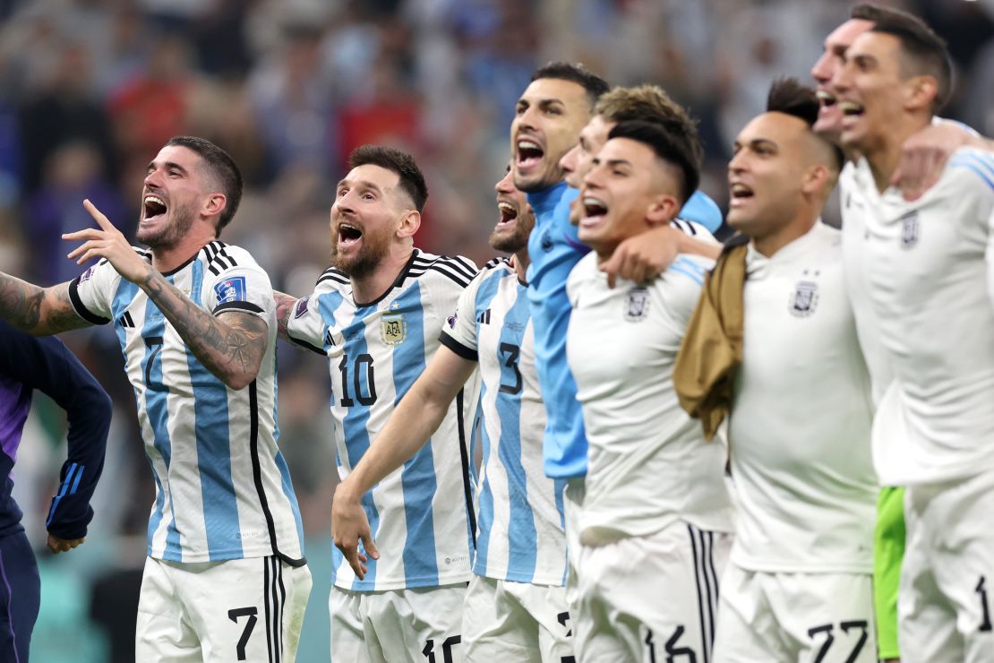 Argentina's players celebrate with their fans at full time.