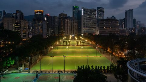Lights illuminate the closed-off football pitches at Victoria Park, after police closed the venue on June 4, 2021 in Hong Kong.