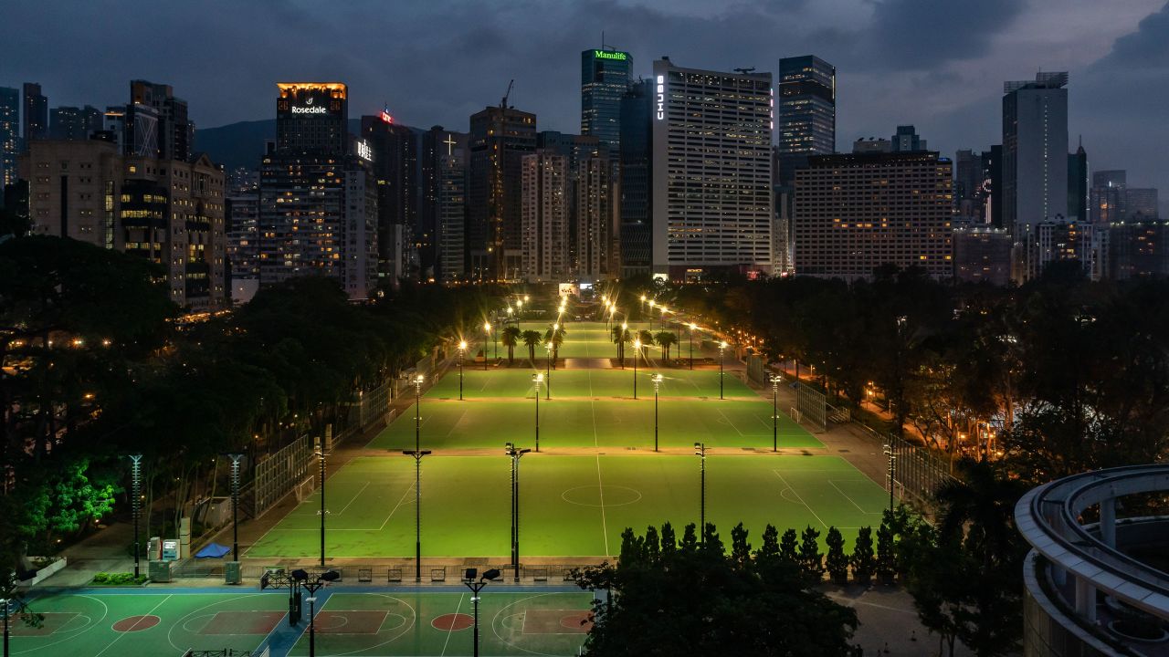 Lights illuminate the closed-off football pitches at Victoria Park, after police closed the venue on June 4, 2021 in Hong Kong.