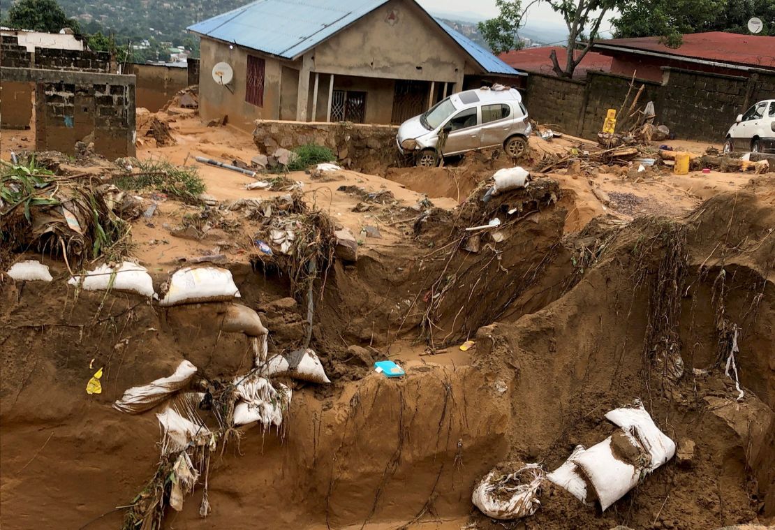 A car is seen stuck after heavy rains caused floods and landslides, on the outskirts of Kinshasa, Democratic Republic of Congo December 13,2022.