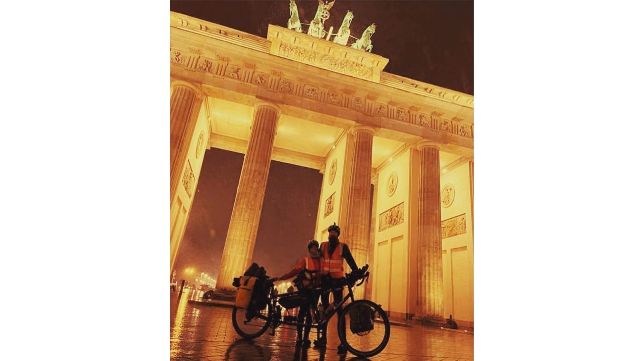Laura Massey-Pugh and Stevie Massey arrive at Brandenburg Gate, Berlin on December 1 after cycling around the world.