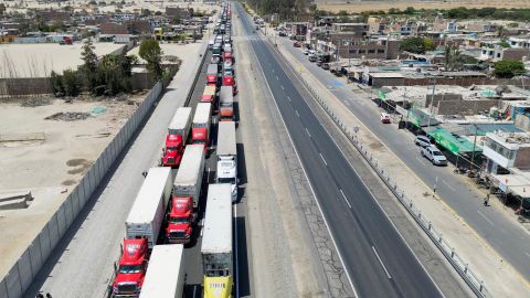 Truck drivers wait as demonstrators block a highway to Lima while demanding early elections and the release of ousted leader Pedro Castillo, in Ica, Peru December 13, 2022. 
