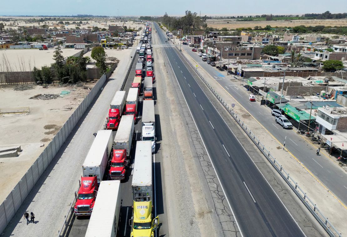 Truck drivers wait as demonstrators block a highway to Lima while demanding early elections and the release of ousted leader Pedro Castillo, in Ica, Peru December 13, 2022.  