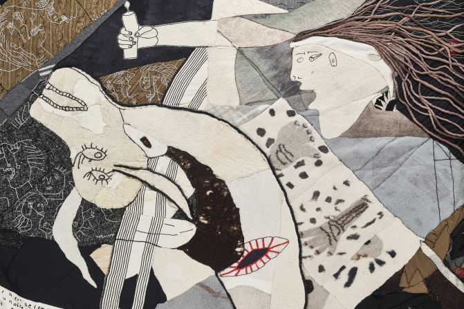 A detail from the "Keiskamma Guernica." The work is every bit as intense as Picasso's, featuring dying children and adults, and weeping women. In the center of the Keiskamma Art Project's tapestry is a stabbed cow, in place of Picasso's gored horse. 