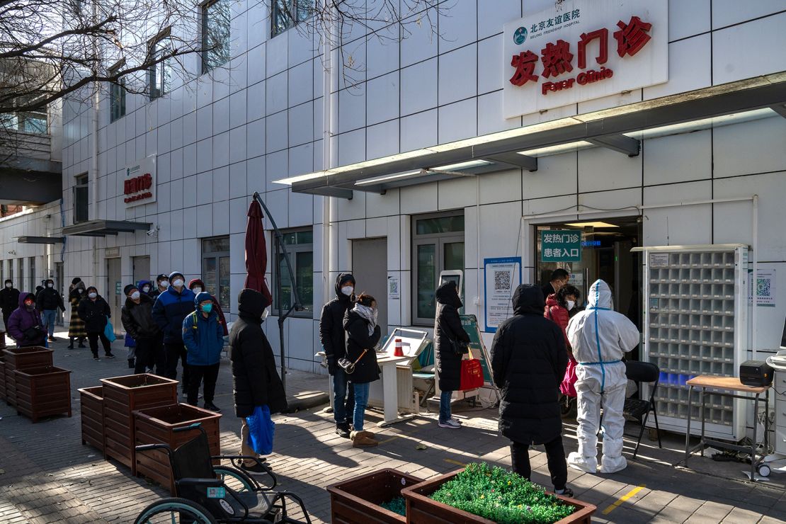 Residents line up at a fever clinic in Beijing, China, on Tuesday, December 13, 2022. 
